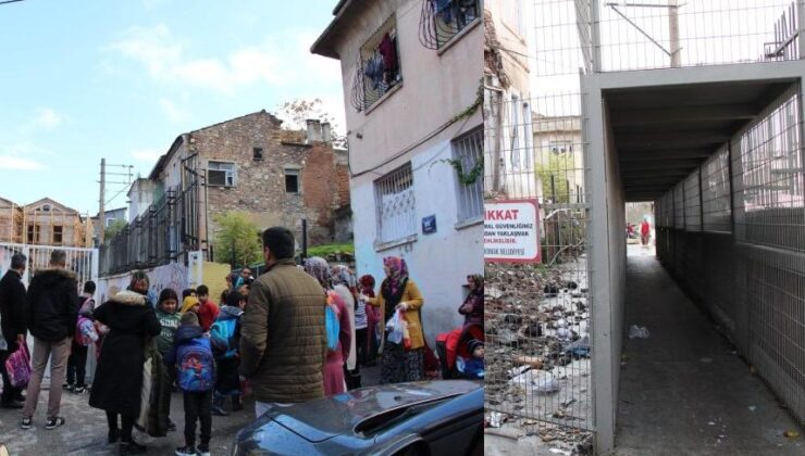 700 öğrenci okula sağ salim girmek için çelik tünelin içinden geçiyor